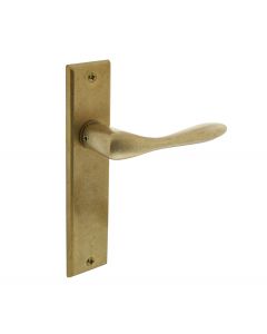 Intersteel Deurkruk Banaan met schild 181x41x7mm blind messing getrommeld